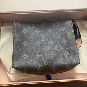 Real Louis Vuitton Pouch, pen marks inside is only wear